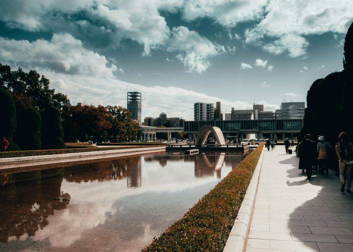 The spacious area of Hiroshima Peace Memorial Park on a sunny day.